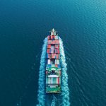 Aerial view container ship full speed for logistics shipping, import export or transportation concept background.