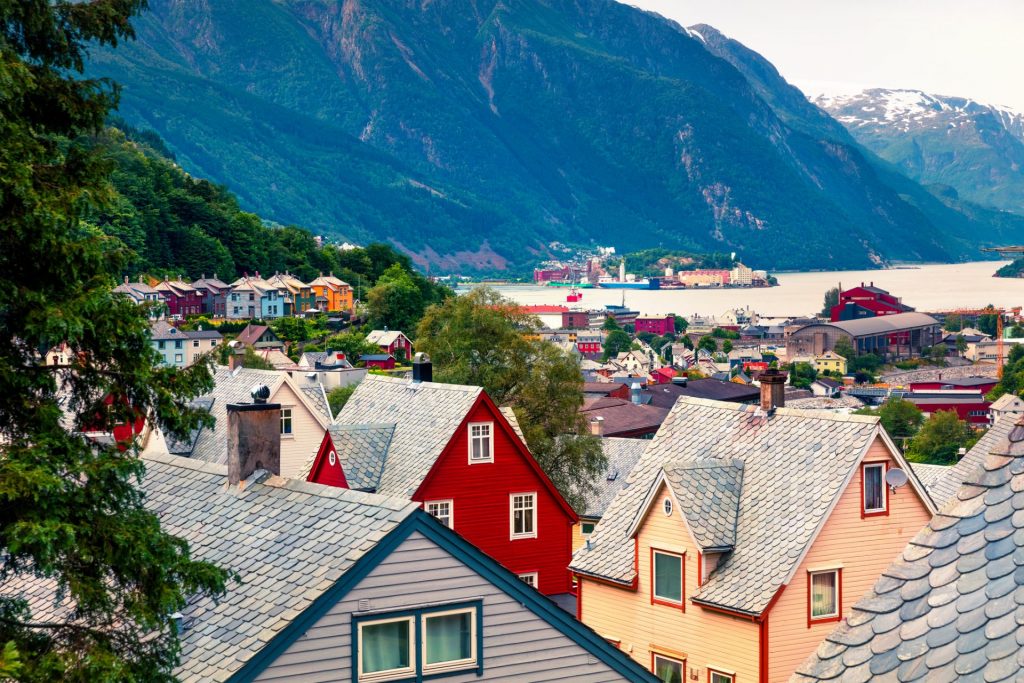 Typical Norwagian architecture in Odda town, Hordaland county, Norway. Beautiful summer view of Hardangerfjord fjord.