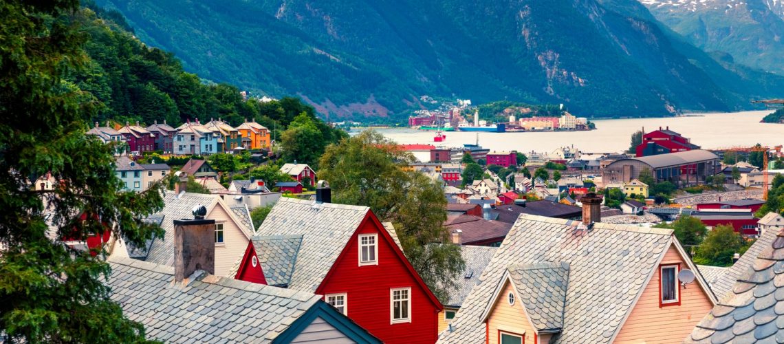 Typical Norwagian architecture in Odda town, Hordaland county, Norway. Beautiful summer view of Hardangerfjord fjord.